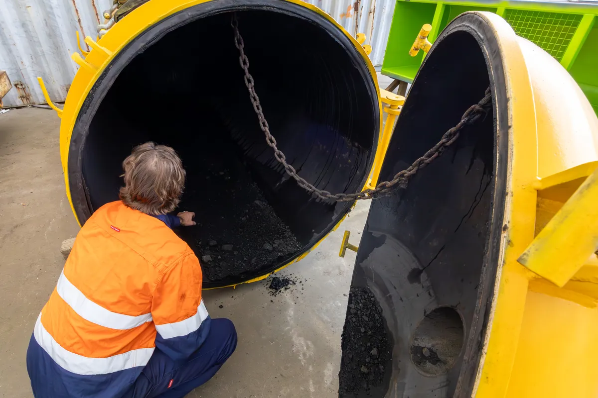 APEC inspector carrying out an internal inspection through the open end of a vessel