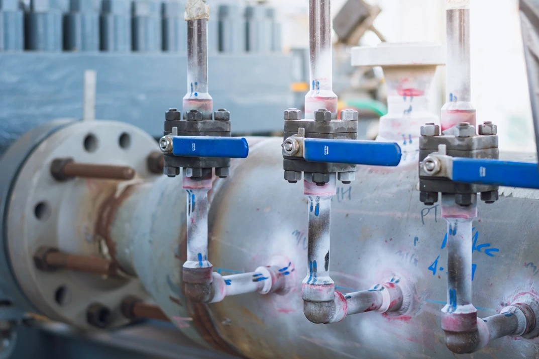 penetrant testing welds of the piping of the oil pipeline